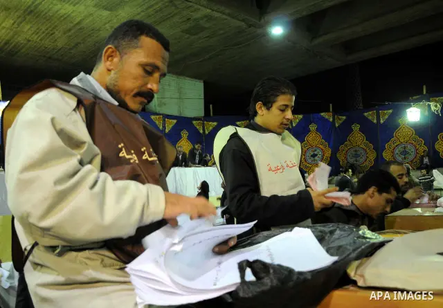 Election workers count ballots for the parliamentary elections in Luxor, Egypt, Tuesday, Nov. 29, 2011. Egypt's military rulers are taking credit for the strong turnout in the country's first parliamentary elections sinc...