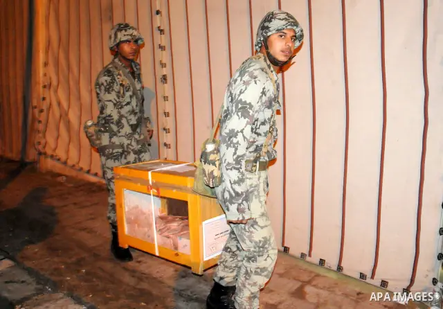 Egyptian soldiers collect sealed ballot boxes from polling stations to transfer them to the counting center at the end of the voting day in Cairo on November 29, 2011. Egyptians went to the polls today for a second day o...