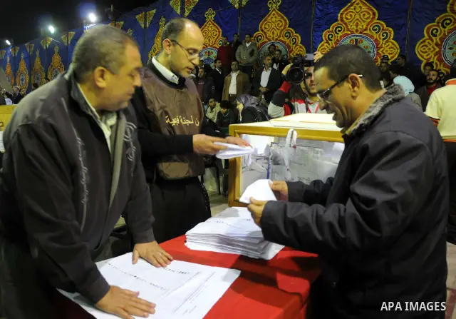Election workers count ballots for the parliamentary elections in Luxor, Egypt, Tuesday, Nov. 29, 2011. Egypt's military rulers are taking credit for the strong turnout in the country's first parliamentary elections sinc...