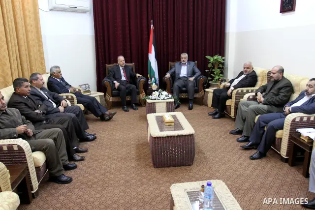 Palestinian prime minister in Gaza Strip, Ismail haniya attends a meeting with a delegation from the Democratic Front for Liberation Palestine at his office, in Gaza city on Nov. 30,2011. Photo by Mohammed Asad