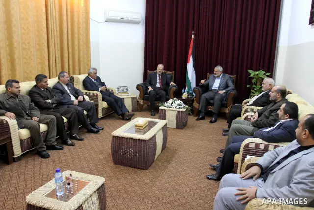 Palestinian prime minister in Gaza Strip, Ismail haniya attends a meeting with a delegation from the Democratic Front for Liberation Palestine at his office, in Gaza city on Nov. 30,2011. Photo by Mohammed Asad