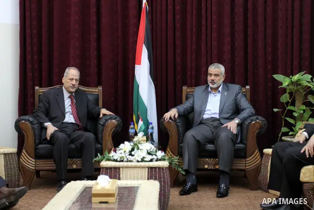 Palestinian prime minister in Gaza Strip, Ismail haniya attends a meeting with a delegation from the Democratic Front for Liberation Palestine at his office, in Gaza city on Nov. 30,2011. Photo by Mohammed Asad
