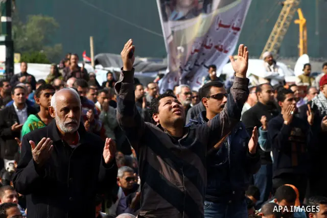Egyptian protesters attend Friday prayers during a demonstration in Tahrir Square, in Cairo, Egypt, Friday, Dec. 2, 2011. Islamists appear to have taken a strong majority of seats in the first round of Egypt's first parl...