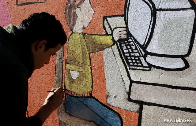 Palestinian Artists take part in paint a murals to mark the International Day for Persons with Disabilities on Dec. 03, 2011 in Gaza City.Photo by Mahmud Nassar