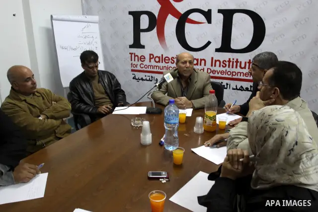 Members for Palestinian journalists during a workshop with political analyst, Helmi Mosa, in Gaza City, on DEC. 03, 2011. Photo by Mohammed Asad