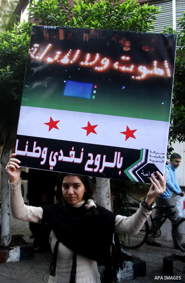 Syrians living in Egypt demonstrate against the recent actions of the Syrian government, in Cairo, Egypt on Dec 03,2011. Photo by Ashraf Amra