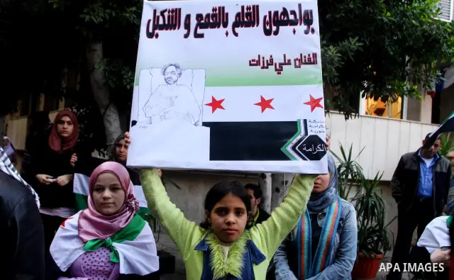 Syrians living in Egypt demonstrate against the recent actions of the Syrian government, in Cairo, Egypt on Dec 03,2011. Photo by Ashraf Amra
