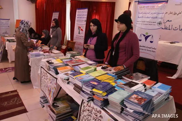 Palestinians participate in the opening of an exhibition of national products in Gaza city on Dec. 04, 2011 . Photo by Mohammed Asad