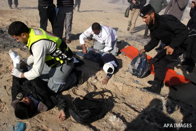 Members of the Palestinian civil defence demonstrate thier skills during a training session following the campaign "your Safety", in Gaza city on Dec. 04, 2011. Photo by Mohammed Asad