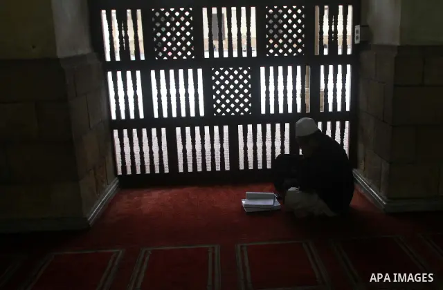 An Indonesian Muslim student reads from the Koran, Islam's holy book at Al-Azhar mosque in the old city of Cairo on December 4, 2011. Al-Azhar mosque, which was developed into one of the oldest Islamic universities, pays...
