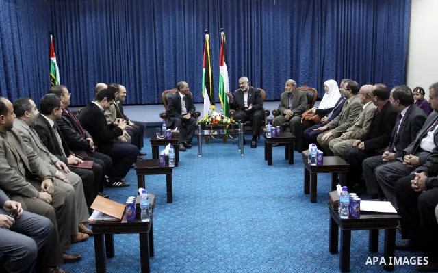 Palestinian prime minister in Gaza Strip, Ismail Haniya meets with a delegation from Arab Doctors Union headed by Osama Raslan at his office in Gaza city on Dec. 5,2011. The delegation is in an official visit to Gaza Str...