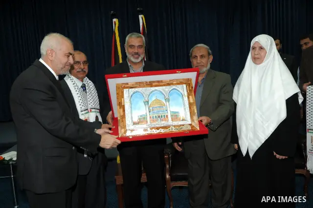 Palestinian prime minister in Gaza Strip, Ismail Haniya meets with a delegation from Arab Doctors Union headed by Osama Raslan at his office in Gaza city on Dec. 5,2011. The delegation is in an official visit to Gaza Str...
