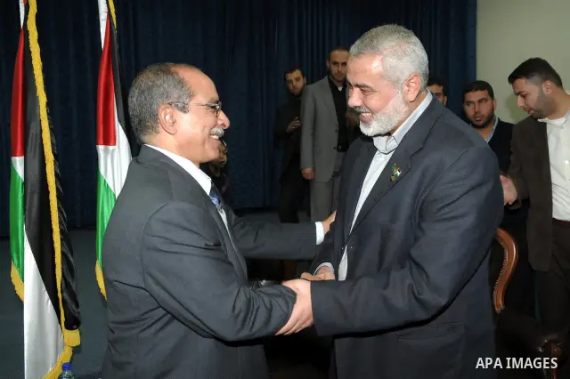 Palestinian prime minister in Gaza Strip, Ismail Haniya meets with a delegation from Arab Doctors Union headed by Osama Raslan at his office in Gaza city on Dec. 5,2011. The delegation is in an official visit to Gaza Str...