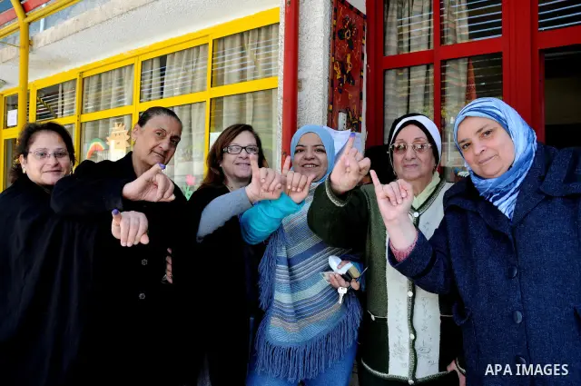 Egyptians cast their ballot at a parliamentary polling station in the run-off of the first round of voting in the Cairo neighbourhood of Bab El-Shaeria on December 5, 2011. Islamist candidates in Egypt looked to extend t...