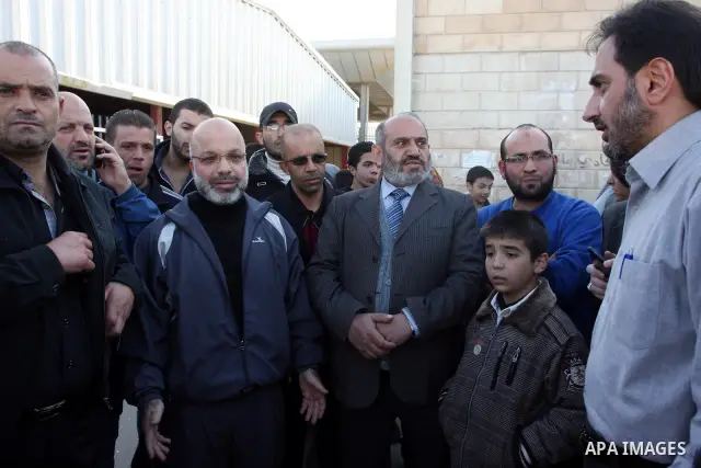 Palestinian lawmaker from Hamas , Ahmed Attoun, being welcomed by his friends at Kalandia checkpoint leading from Jerusalem to Ramallah, 06 December 2011, after his release from an Israeli jail. Atawni is a resident of E...