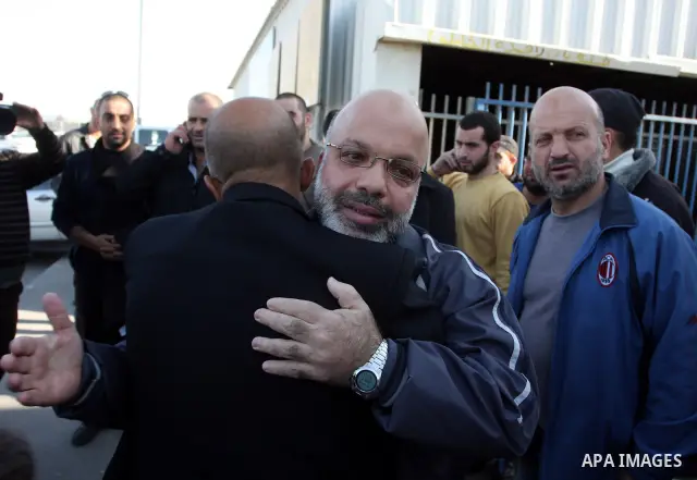 Palestinian lawmaker from Hamas , Ahmed Attoun, being welcomed by his friends at Kalandia checkpoint leading from Jerusalem to Ramallah, 06 December 2011, after his release from an Israeli jail. Atawni is a resident of E...