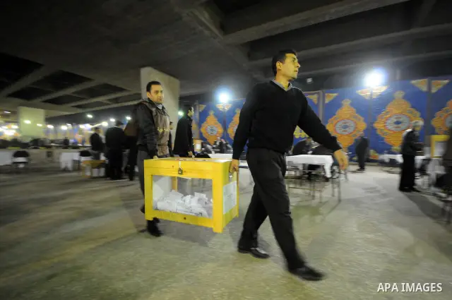 Egyptian election officials count ballots at the end the voting on the final day of the run-off for the first round of elections in Cairo on December 6, 2011. Photo by Ahmed Asad