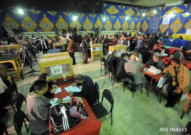 Egyptian election officials count ballots at the end the voting on the final day of the run-off for the first round of elections in Cairo on December 6, 2011. Photo by Ahmed Asad