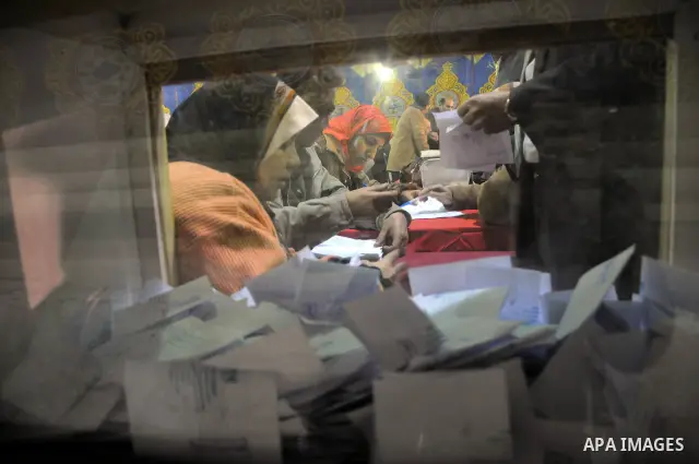 Egyptian election officials count ballots at the end the voting on the final day of the run-off for the first round of elections in Cairo on December 6, 2011. Photo by Ahmed Asad