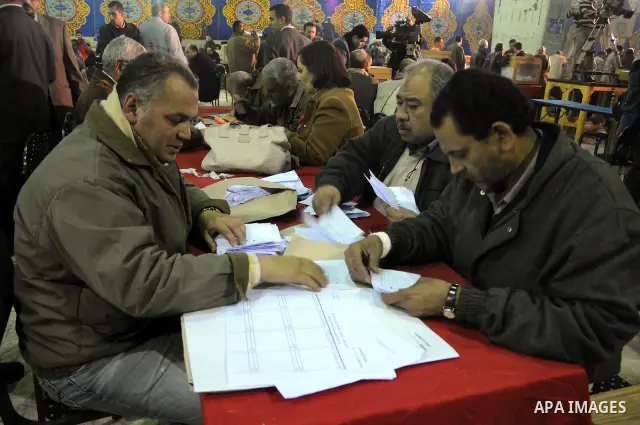 Egyptian election officials count ballots at the end the voting on the final day of the run-off for the first round of elections in Cairo on December 6, 2011. Photo by Ahmed Asad