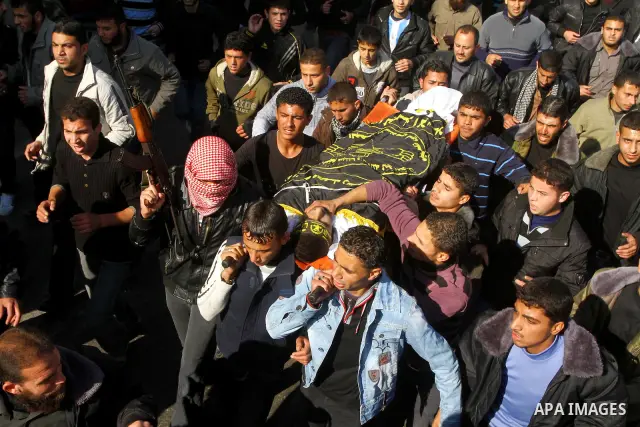 Palestinian mourners carry the body of Islamic Jihad militant Ismail Al-Areer during his funeral in Gaza City on December 7, 2011. A Palestinian was killed and five others were wounded by Israeli air strikes on the Gaza...