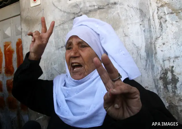 A Palestinian woman mourns during the funeral of Islamic Jihad gunman Ismail Al-Areer in Gaza City December 7, 2011. A Palestinian was killed and five others were wounded by Israeli air strikes on the Gaza Strip early We...