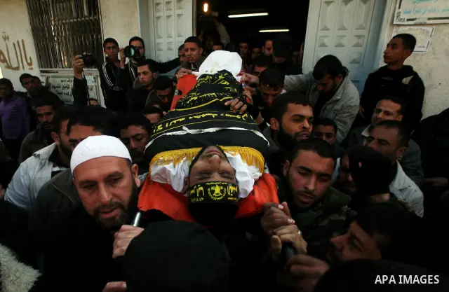 Palestinian mourners carry the body of Islamic Jihad militant Ismail Al-Areer during his funeral in Gaza City on December 7, 2011. A Palestinian was killed and five others were wounded by Israeli air strikes on the Gaza...