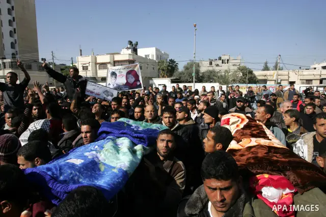 Palestinians protest in front of Khan Yunis Municipality headquarters during the funeral of Wesam,5 years, and his sister Malak Sahloul,3 years, in Khan Younis, southern Gaza Strip on December 7, 2011. Wesam and Malak we...