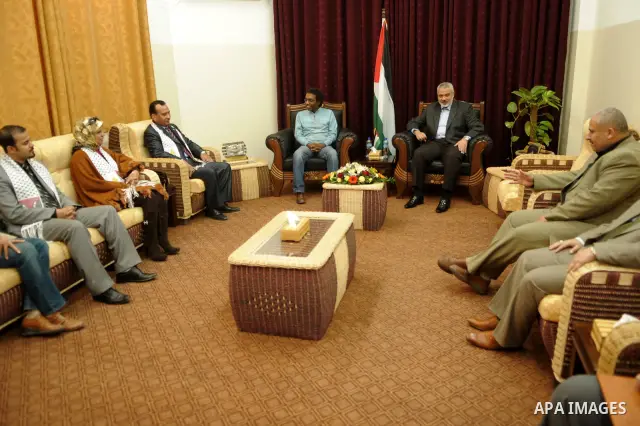 Palestinian prime minister in Gaza Strip, Ismail Haniya meets with the members of Arab delegation at his office in Gaza city on Dec. 7,2011. Photo by Ahmed Shaat