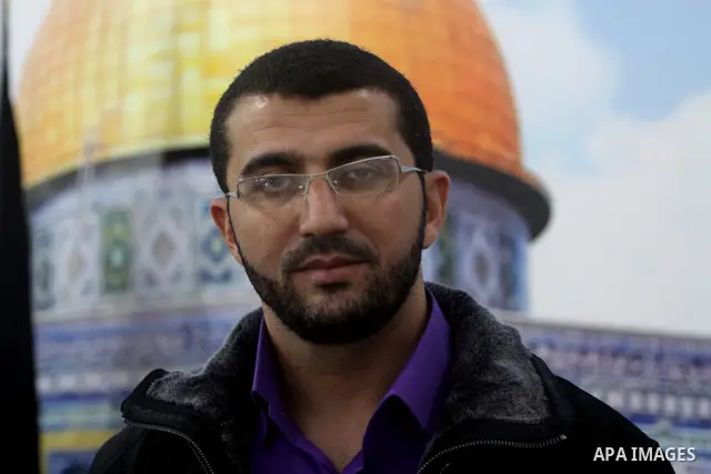 Freed Palestinian prisoner Mohammed Hamada from Jerusalem, who released from an Israeli jail during the swap with the Israeli soldier Gilad Shalit, stands for taking a picture during his wedding party in Gaza city on Dec...