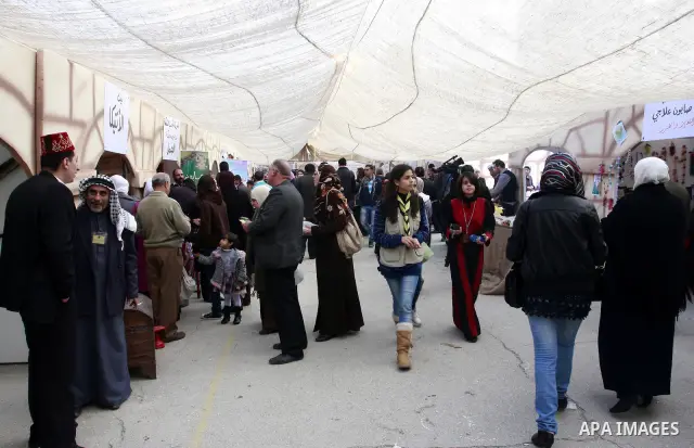 Palestinians participate in an exhibition for national industries in the West Bank city of Nablus, Thursday, Dec. 8, 2011. Photo by Wagdi Eshtayah.