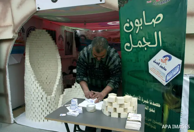 A Palestinian man prepares a soap, a favorite local soap, during a celebration in the West Bank city of Nablus, Thursday, Dec. 8, 2011. Photo by Wagdi Eshtayah.