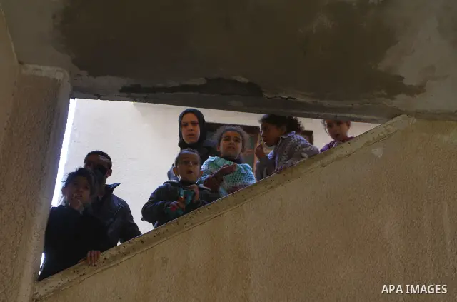 Relatives mourns during the funeral of Palestinian Bahjat Al-Zalan, who was killed in a blast from an Israeli air strike on a nearby Hamas training camp in Gaza City December 9, 2011. Violence across the Israeli-Gaza bor...
