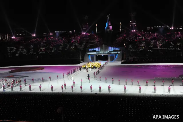 Members of the Palestinian team take part in the opening ceremony of the pan-Arab Games at Sheikh Khalifa stadium in the Qatari capital Doha on December 9, 2011. More than 5,000 Arab athletes are participating in the Ara...