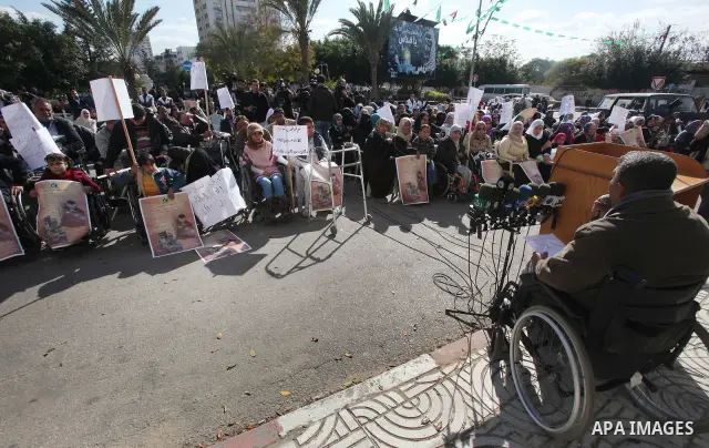 Palestinians Disabled take part in a protest in front of the Palestinian Legislative Council in Gaza City on Dec. 10, 2011. Photo by Yaser Fathi