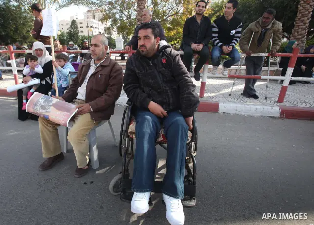 Palestinians Disabled take part in a protest in front of the Palestinian Legislative Council in Gaza City on Dec. 10, 2011. Photo by Yaser Fathi