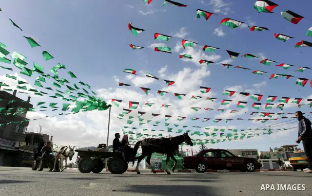 Palestine and Hamas Flags adorn the streets in the preparation of the anniversary of Hamas Islamic movement foundation in refugee camp of Rafah in southern Gaza Strip on December 10, 2011. Photo by Abed Rahim Khatib. Pho...
