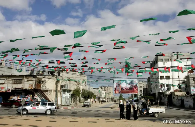 Palestine and Hamas Flags adorn the streets in the preparation of the anniversary of Hamas Islamic movement foundation in refugee camp of Rafah in southern Gaza Strip on December 10, 2011. Photo by Abed Rahim Khatib. Pho...