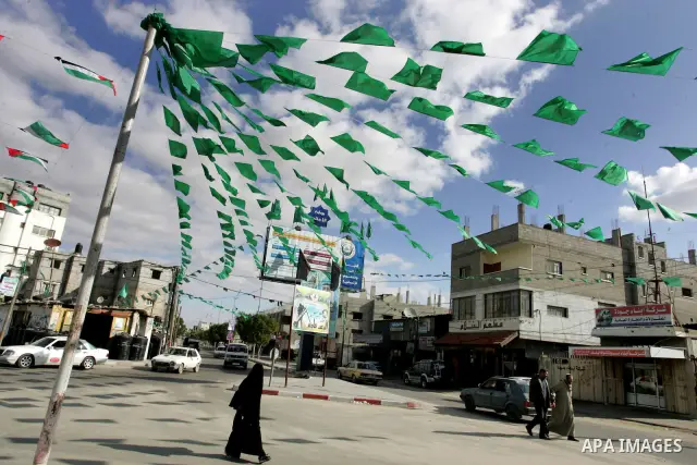 Palestine and Hamas Flags adorn the streets in the preparation of the anniversary of Hamas Islamic movement foundation in refugee camp of Rafah in southern Gaza Strip on December 10, 2011. Photo by Abed Rahim Khatib. Pho...