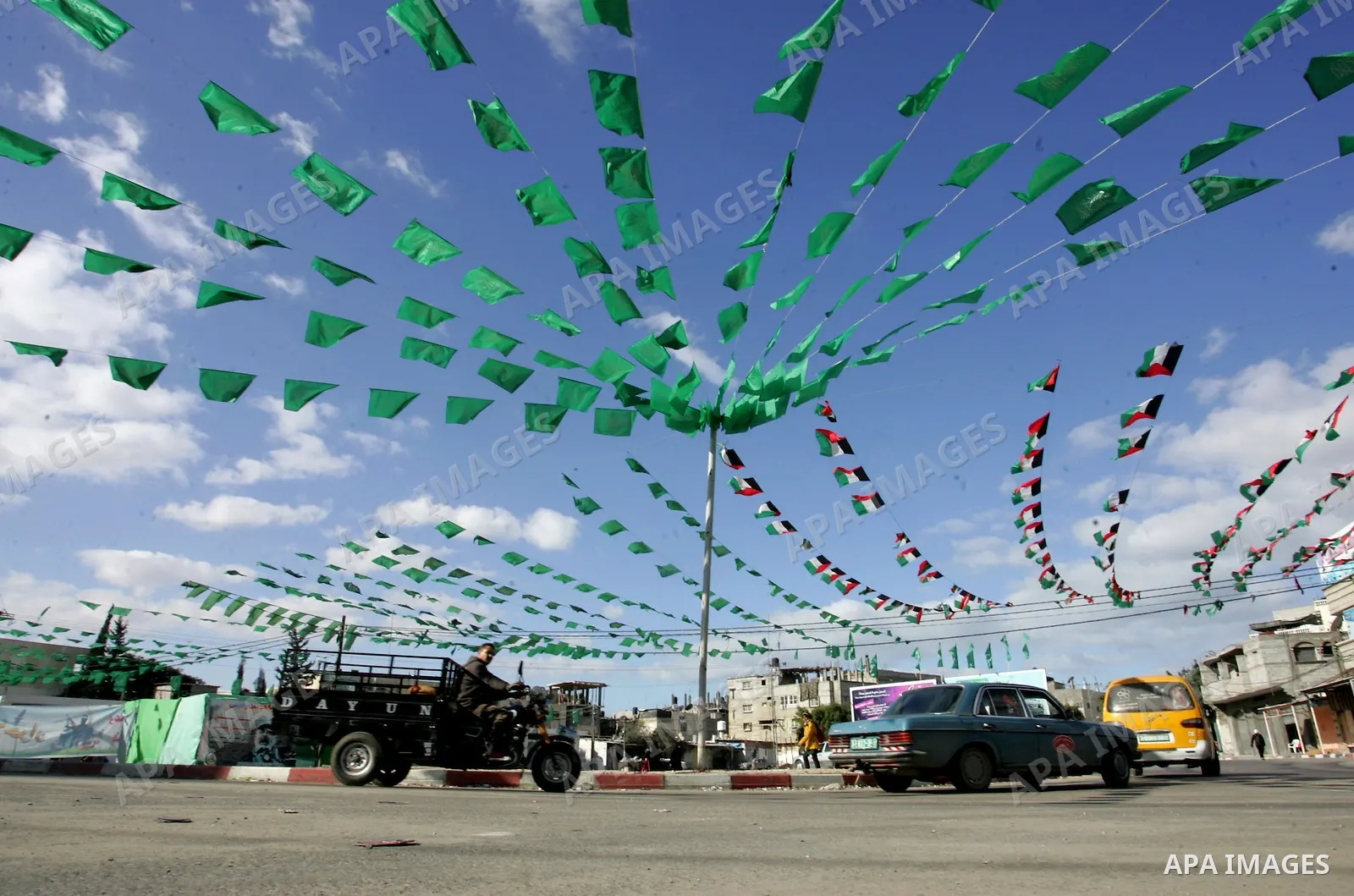 Palestine and Hamas Flags adorn the streets in the preparation of the anniversary of Hamas Islamic movement foundation in refugee camp of Rafah in southern Gaza Strip on December 10, 2011. Photo by Abed Rahim Khatib. Pho...