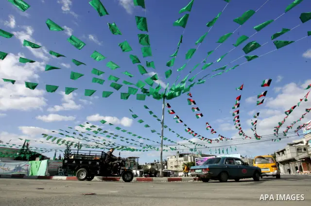 Palestine and Hamas Flags adorn the streets in the preparation of the anniversary of Hamas Islamic movement foundation in refugee camp of Rafah in southern Gaza Strip on December 10, 2011. Photo by Abed Rahim Khatib. Pho...