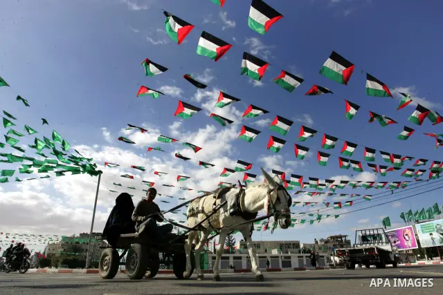 Palestine and Hamas Flags adorn the streets in the preparation of the anniversary of Hamas Islamic movement foundation in refugee camp of Rafah in southern Gaza Strip on December 10, 2011. Photo by Abed Rahim Khatib. Pho...