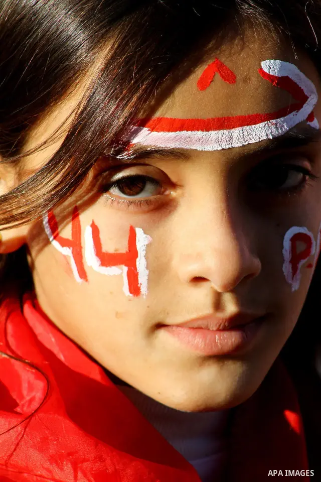 Palestinian supporters of the Popular Front for the Liberation of Palestine (PLFP) wave the group's red flags during a rally held in the northern Gaza Strip town of Beit Lahia on December 10, 2011 to its 44th anniversary...