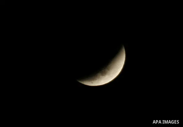 The Earth casts its shadow across the moon's surface during a lunar eclipse in Rafah, in the southern of Gaza Strip on Dec. 10, 2011. This is the second total lunar eclipse of the year and the last until 2014. Photo by A...