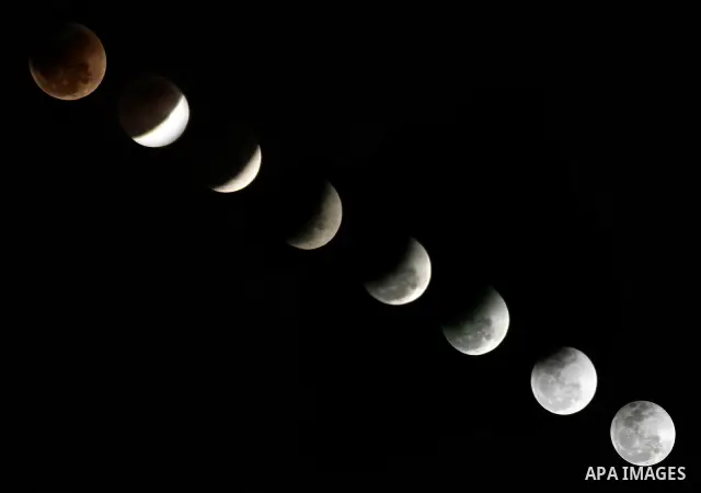 The Earth casts its shadow across the moon's surface during a lunar eclipse in Rafah, in the southern of Gaza Strip on Dec. 10, 2011. This is the second total lunar eclipse of the year and the last until 2014. Photo by A...