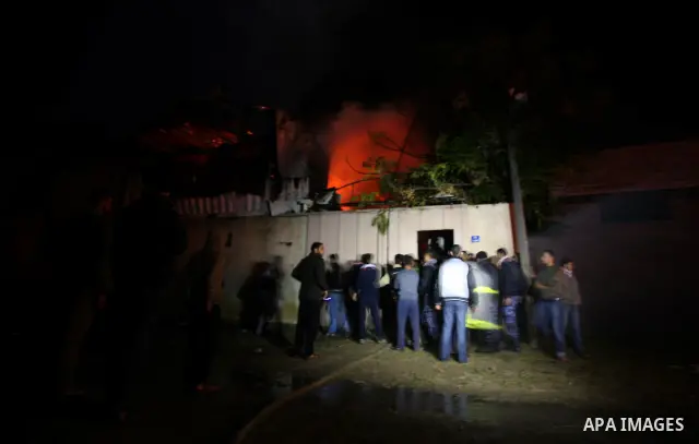 Palestinians Firefighters try to extinguish a fire in a house of Aqel family, following an Israeli airstrike in al- Zaytoun area, in Gaza City, on Dec. 10, 2011. Photo by Mahumd Nassar