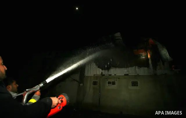 Palestinians Firefighters try to extinguish a fire in a house of Aqel family, following an Israeli airstrike in al- Zaytoun area, in Gaza City, on Dec. 10, 2011. Photo by Mahumd Nassar