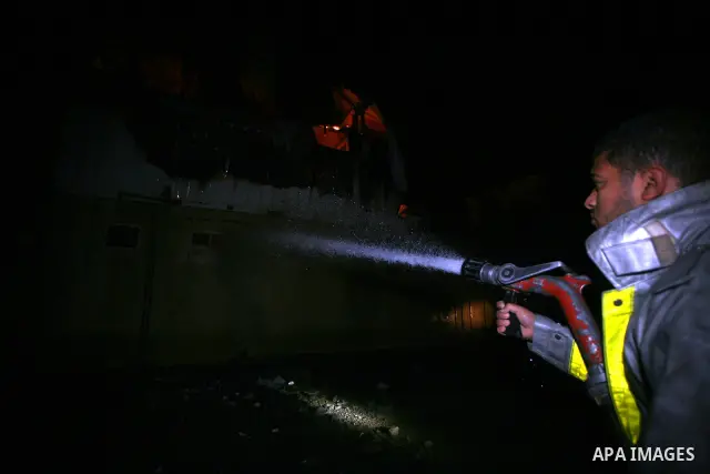 Palestinians Firefighters try to extinguish a fire in a house of Aqel family, following an Israeli airstrike in al- Zaytoun area, in Gaza City, on Dec. 10, 2011. Photo by Mahumd Nassar