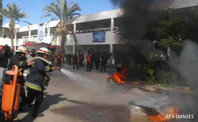 Members of the Palestinian civil defence demonstrate thier skills during a training session following the campaign "your Safety", in school of the girls in Gaza city on Dec. 11, 2011. Photo by Mohammed Asad