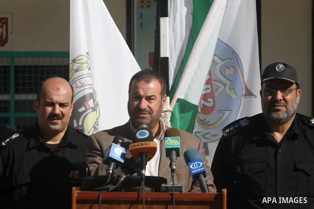 Palestinian Interior Minister in Gaza Strip, Fathi Hammad, speaks as firefighters demonstrate thier skills during a training session following the campaign "your Safety", in school of the girls in Gaza city on Dec. 11, 2...